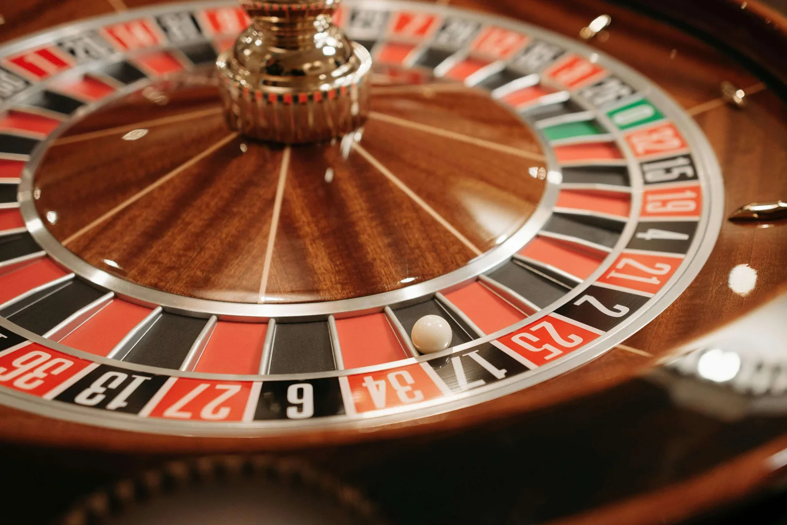 Close-up of a professional roulette wheel with the ball resting in a numbered pocket