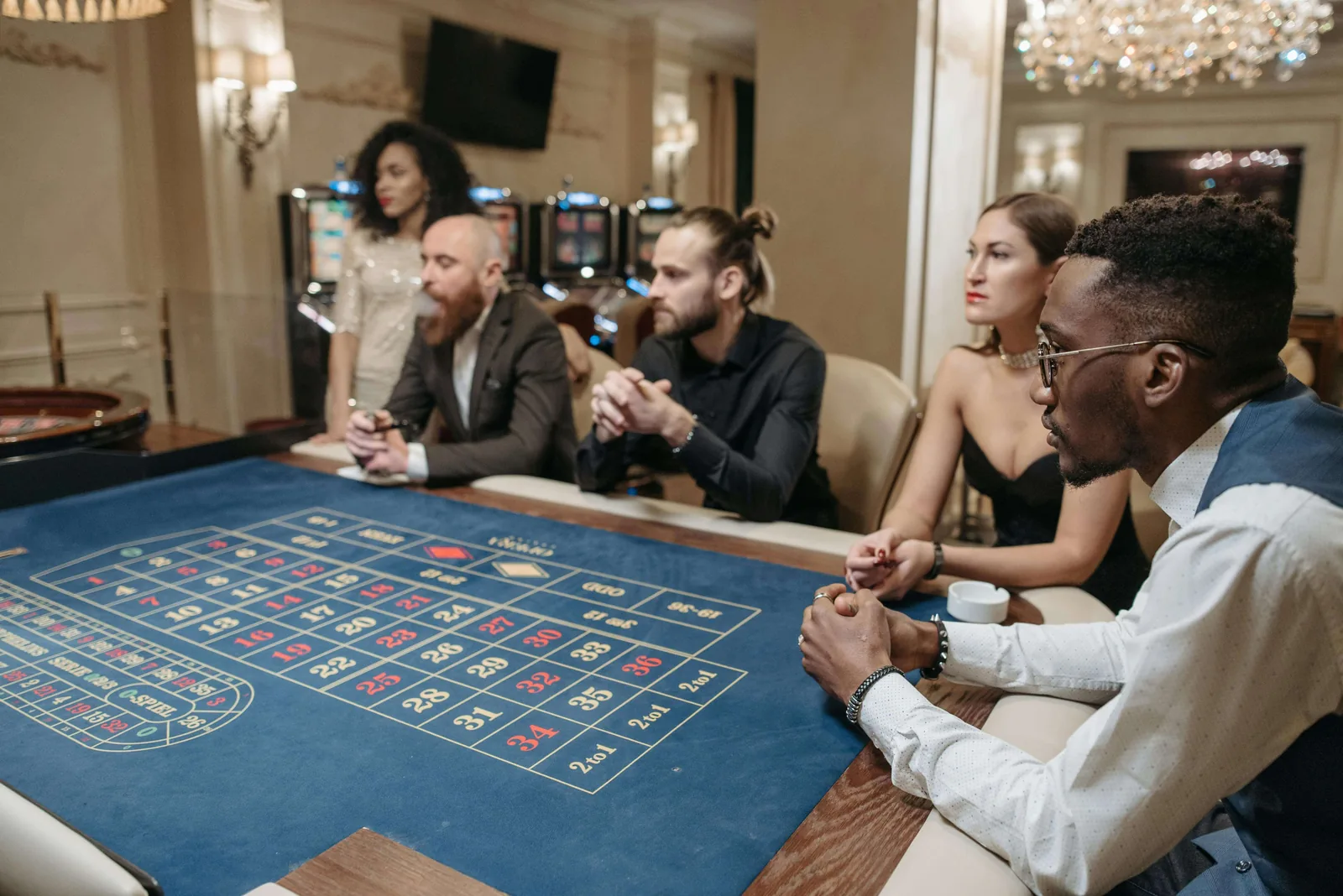 Players around a casino table at a live gaming event